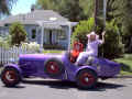 Queen Linda and daughter Lea in Alyce's purple car.