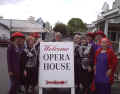 Left to right: Red Hatters, along with some of the opera cast: Sue, Ann, Fran, Linda, Darlyn, and Betty